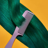 A section of straight, bright green  hair on a yellow background being combed, showcasing the Punky Colour Sugar Cloud Semi Permanent Foam Color